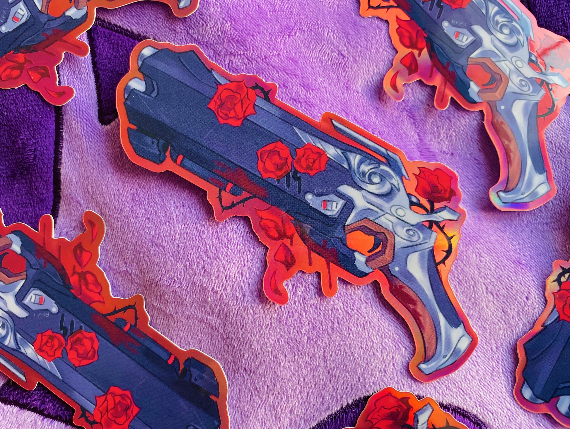 Reaper sticker of his gun with thorn roses and blood