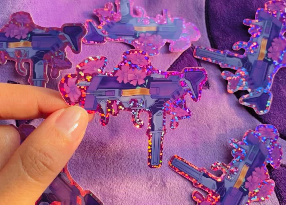 Sombra gun sticker video showing the pink and purple glitter 