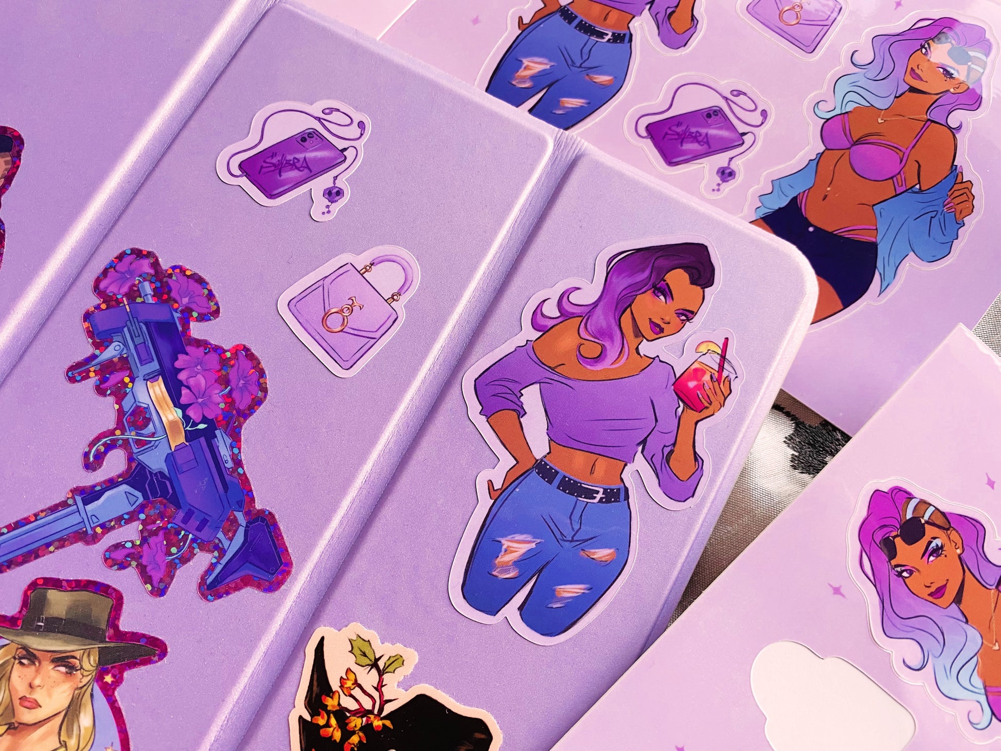 An example of the Sombra casual outfit sticker on a case, alongside the purple phone and handbag sticker